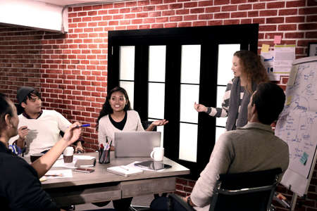 Group of businesspersons in creative business discussing work in the officeの写真素材