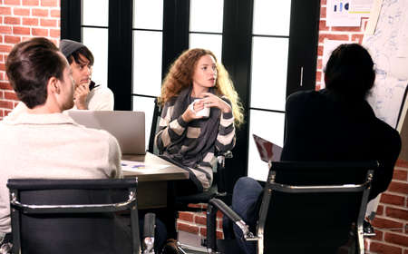 Group of businesspersons in creative business discussing work in the officeの写真素材