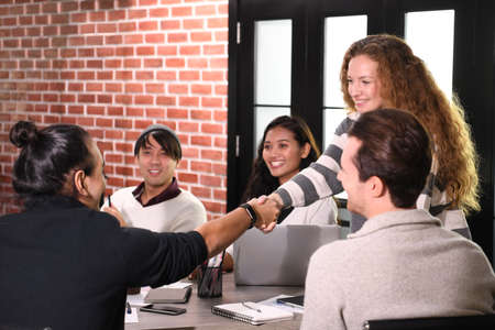 Group of businesspersons in creative business discussing work in the officeの写真素材