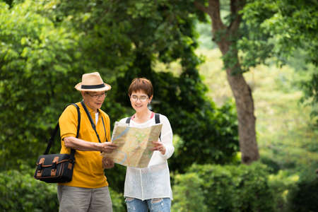 Image of happy romantic Asian senior couple outdoor in parkの写真素材