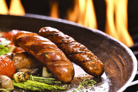 Grilled sausages and various vegetables  in iron panの写真素材
