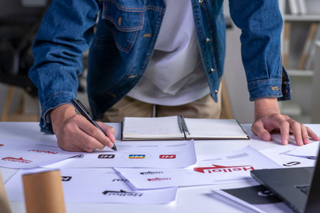 Graphic designer drawing sketches design. The concept of a new brand. Professional creative...
