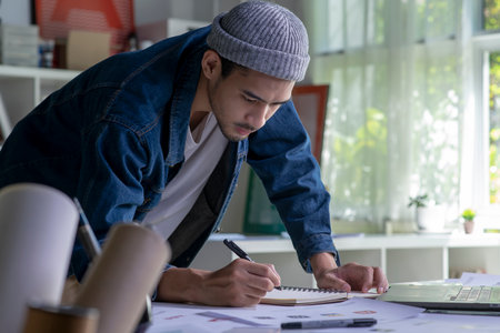 Asian man Graphic designer working in office. Artist Creative Designer Illustrator Graphic Skill Concept.の写真素材