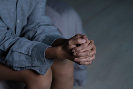 Female hands showing stress, young woman feeling sad tired and worried suffering depression in mental healthの写真素材