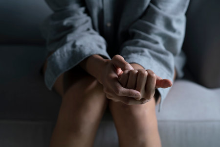 Female hands showing stress, young woman feeling sad tired and worried suffering depression in mental healthの写真素材
