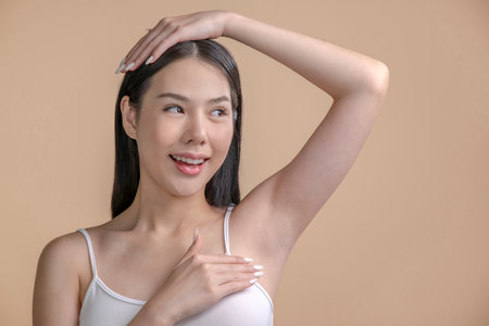 Portrait of a young Asian woman with natural makeup and natural styling. Advertising natural cosmetics. Advertising for a beauty salon. Care cosmetics, face and body skin care.の写真素材