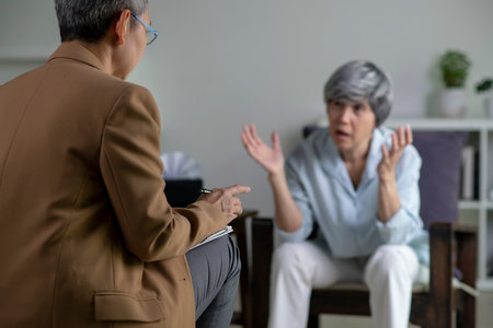 Therapist, psychologist talking and counselling to Asian patient at office during psychology treatment.の写真素材