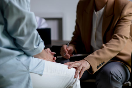 Female therapist, psychologist talking and counselling to patient at office during psychology treatmentの写真素材