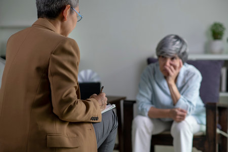 Therapist, psychologist talking and counselling to Asian patient at office during psychology treatment.の写真素材