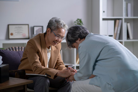 Therapist, psychologist talking and counselling to Asian patient at office during psychology treatment.の写真素材