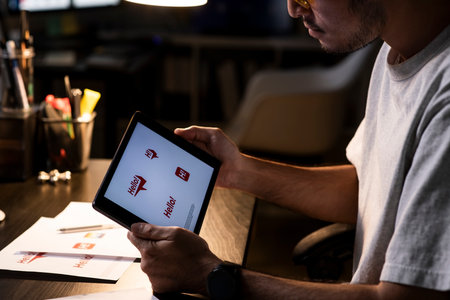 Asian man graphic designer working on computer drawing sketches logo design. The concept of a new brand. Professional creative occupation with idea.の写真素材