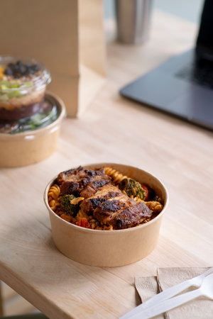 Close up paper bowl with healthy food on work place of working desk, Healthy eating clean food habits for diet and health care concept, Delicious balanced food concept.の写真素材