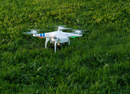Photo drone on a grassy field ready to take off