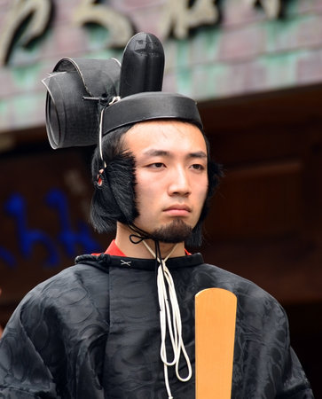Mount Koya, Japan - June 14, 2011: Young man in formal Shinto priest attire during Aoba festivalのeditorial素材