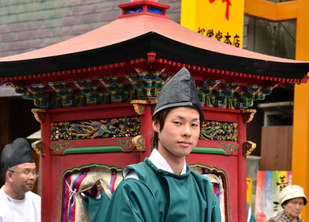 Mount Koya, Japan - June 14, 2011: Young man in formal Shinto priest attire during Aoba festivalのeditorial素材