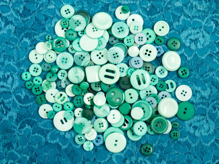 Assorted sewing buttons on blue backgroundの写真素材