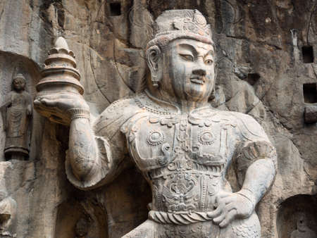 Stone buddhist statue in Longmen Grottoesの写真素材