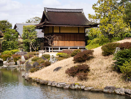 Traditional Japanese garden with pond and tea houseの写真素材
