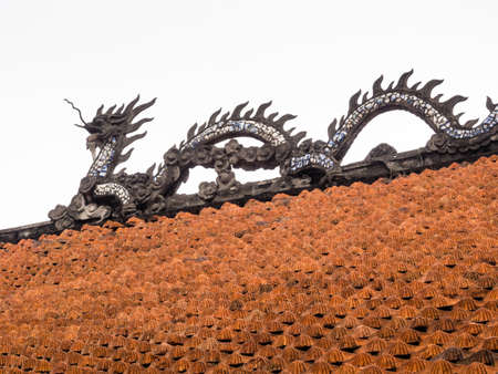 Chinese dragon on the roof of Van Mieu temple in Hanoi, Vietnamの写真素材