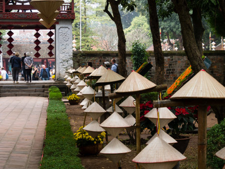 Hanoi, Vietnam - March 7, 2016: Straw hats lined up at the courtyard of the temple of literatureのeditorial素材