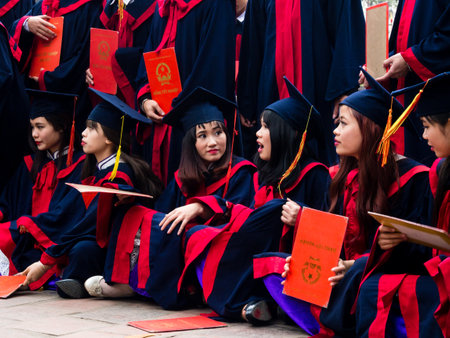 Hanoi, Vietnam - March 7, 2016: Vietnamese students celebrating graduation at the temple of literatureのeditorial素材