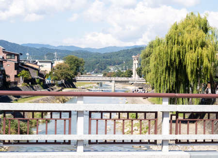 Takayama, Japan - October 6, 2015: Sun shining over Miyagawa river with it's many bridgesの写真素材