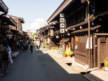 Takayama, Japan - October 6, 2015: Visitors strolling in the historic Sannomachi districtのeditorial素材