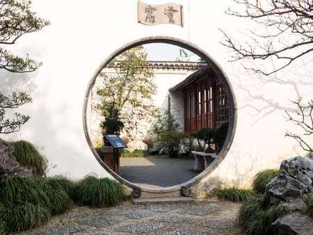 Suzhou, China - March 21, 2016: Round gate in classical Master of the Nets Gardenのeditorial素材