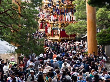 Takayama, Japan - October 9, 2015: Crowd of visitors at the entrance to Hachimangu shrine during annual Takayama Autumn Festival, one of the most famous festivals in Japanのeditorial素材