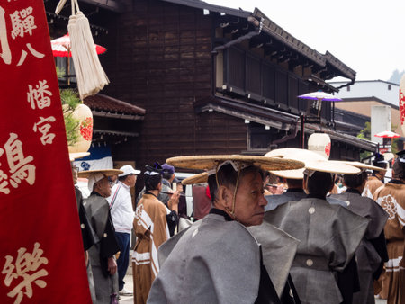 Takayama, Japan - October 10, 2015: Local people in traditional costumes marching the streets of historic Takayama during the annual Takayama Autumn Festival paradeのeditorial素材