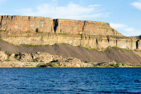 Banks lake and the walls of Grand Coulee in Steamboat Rock state park in Eastern Washington state, USAの写真素材