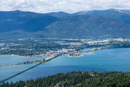 View of Lake Pend Oreille and the town of Sandpoint, Idaho, from the top of the mountainの写真素材