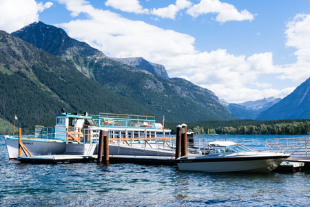 Glacier National Park, USA - July 4, 2016: Tourist boat on Lake McDonald in West Glacier waiting for visitors to boardのeditorial素材