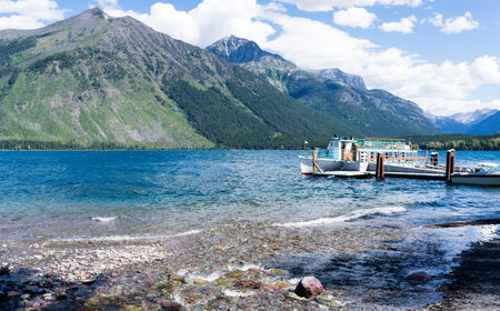 Glacier National Park, USA - July 4, 2016: Tourist boat on Lake McDonald in West Glacier waiting for visitors to boardのeditorial素材