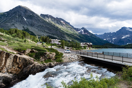 Glacier National Park, USA - July 4, 2016: Car driving out of Many Glacier Hotel in Many Glacier areaのeditorial素材