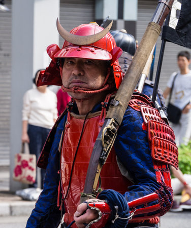 Gifu, Japan - October 4, 2015: Man dressed as samurai in armor with hackbut during the 59th annual Nobunaga Festival historical reenactment paradeのeditorial素材