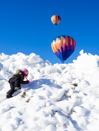 Winthrop, WA / USA - March 4, 2017: Little girl having fun at Winthrop Balloon Festivalのeditorial素材