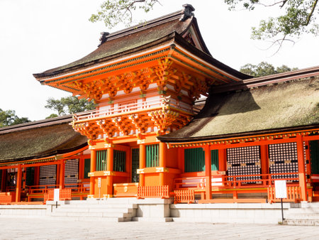 Red buildings of Usa Jingu shrine under bright sun