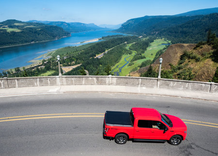 Corbett, OR, USA - July 23, 2017: Red car driving along a scenic route near Crown Point Vista House in Columbia River Gorgeのeditorial素材