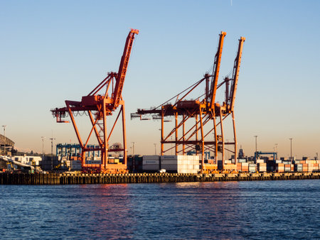 Seattle, WA, USA - April 1, 2016: Cargo cranes at the port of Seattle at sunsetのeditorial素材