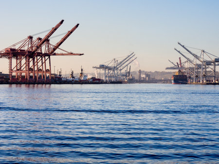 Seattle, WA, USA - April 1, 2016: Cargo cranes at the port of Seattle at sunsetのeditorial素材