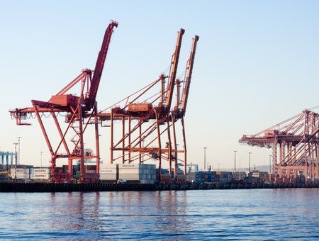 Seattle, WA, USA - April 1, 2016: Cargo cranes at the port of Seattle at sunsetのeditorial素材