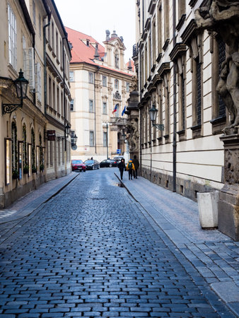 Prague, Czech Republic - December 12, 2018: Narrow cobblestone street in historic Prague Old Townのeditorial素材