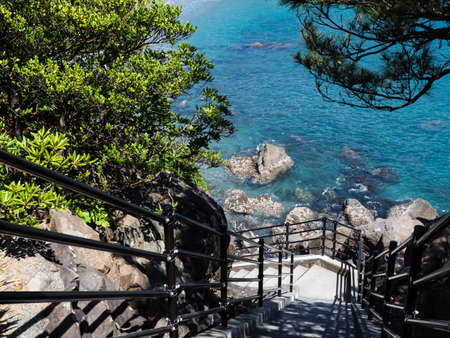 Stone steps leading to Ryuogu Shrine at Katsurahama beach, a famous scenic spot on the outskirts of Kochi cityの写真素材
