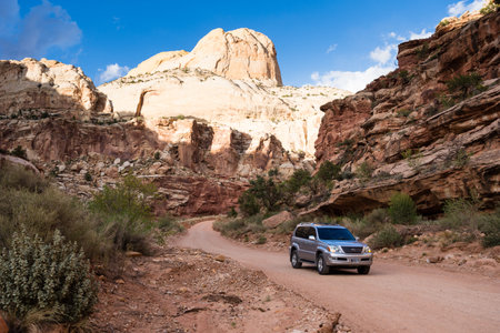 Utah, USA - April 20, 2017: Car driving on an unpaved road leading to Capitol Gorge trailhead in Capitol Reef National Parkのeditorial素材