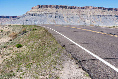 Scenic state route 24 running through desert near Caineville - Utah, USAの写真素材