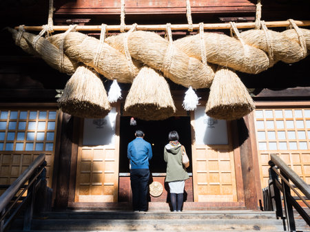 Shimosuwa, Nagano prefecture, Japan - October 22, 2017: Visitors praying at Suwa Taisha Shimosha Akimiya, one of the four shrines in Suwa Grand Shrine complexのeditorial素材