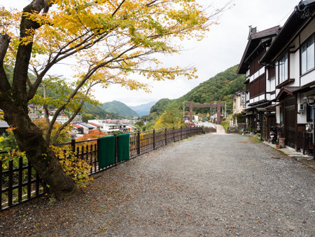 Kiso, Nagano prefecture, Japan - October 23, 2017: Traditional Japanese houses and fall foliage at the entrance to Fukushima Checkpoint Museumのeditorial素材
