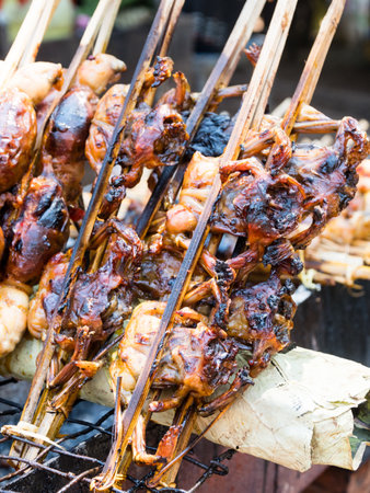 Grilled frogs selling on a street market in Oudong, Cambodiaの写真素材