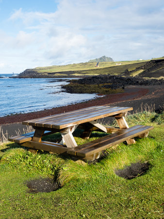 Picnic table on Klauf beach, Heimaey Island - Westman Islands, Icelandの写真素材